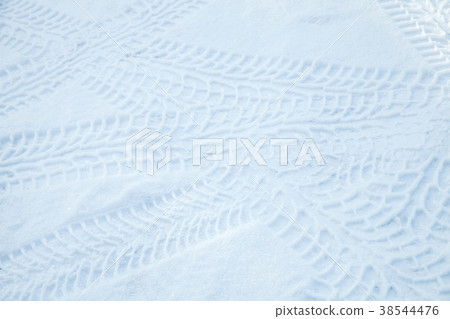 Tire tracks pattern over winter road Tire tracks pattern over winter road 38544476