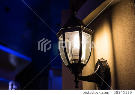 .The wall lamp is on fire at night. .The wall lamp is on fire at night. 38545159
