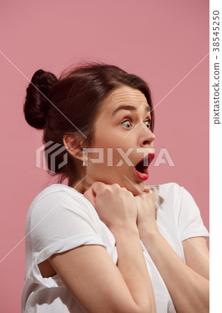 Beautiful woman looking suprised isolated on pink Beautiful woman looking suprised isolated on pink 38545250