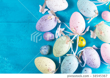 Easter eggs on bright blue background Easter eggs on bright blue background 38545367