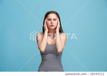 Woman having headache. Isolated over blue Woman having headache. Isolated over blue 38545511