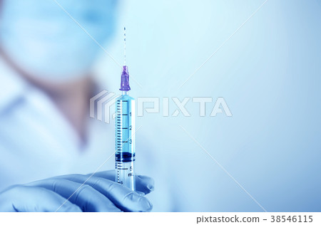 Close up a medical injection syringe in hand 38546115