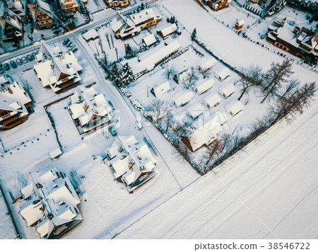 view from the drone on the roofs of a small village in winter view from the drone on the roofs of a small village in winter 38546722