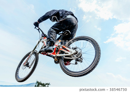 downhill cyclist flying downhill cyclist flying 38546730