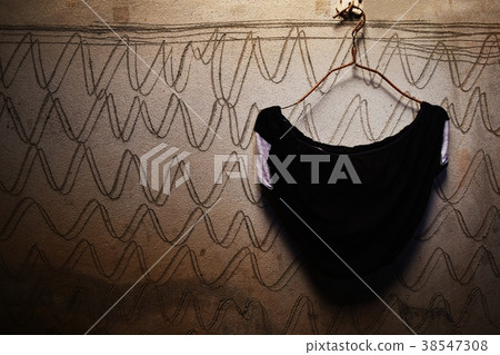 black underwear on hanger and dirty cement wall black underwear on hanger and dirty cement wall 38547308