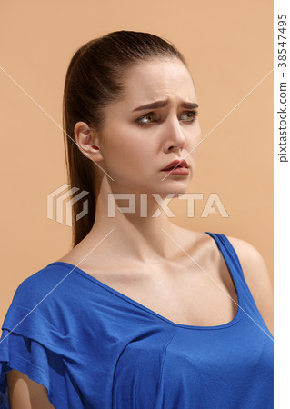 The young woman is looking sad on the pastel 38547495