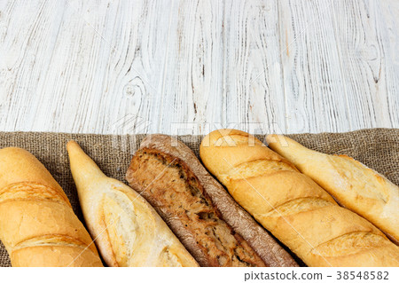 French baguette on the kitchen table. Close-up French baguette on the kitchen table. Close-up 38548582