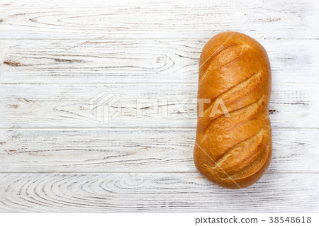 Fresh bread on wooden table. Top view Fresh bread on wooden table. Top view 38548618