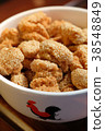 A close up of a bowl of Chinese sesame cookies 38548849