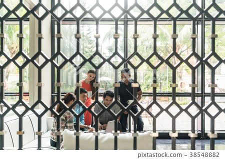 Group of employees drinking coffee in the lounge 38548882