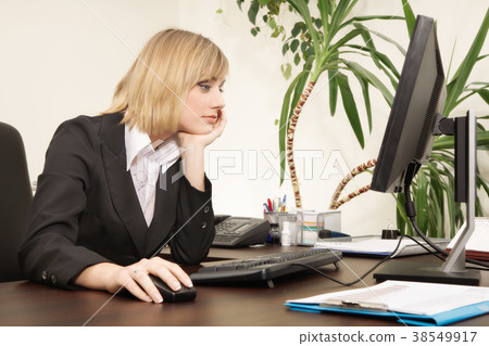 Woman working with computer in the office Woman working with computer in the office 38549917