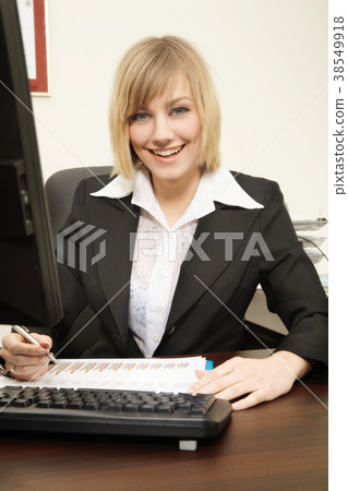 Woman working with computer in the office Woman working with computer in the office 38549918