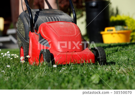 lawnmower on green grass lawnmower on green grass 38550070