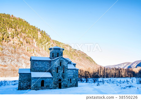 Central medieval church in Arkhyz in winter 38550226