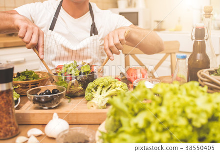 Chef man cooking in the kitchen 38550405