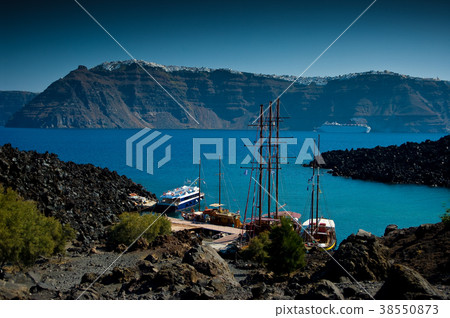 The volcanic island named Nea Kameni. Greece. The volcanic island named Nea Kameni. Greece. 38550873