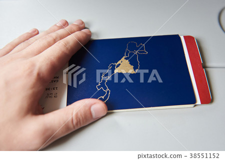 Close-up of passport with airplane ticket 38551152