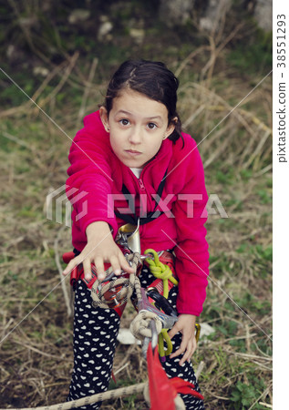 Girl with climbing equipment needs help 38551293