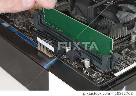 Close up of man hand installing Ram  memory 38551708