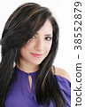 Pretty woman smiling against white background 38552879