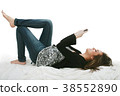 Relaxed young woman sending a text message 38552890