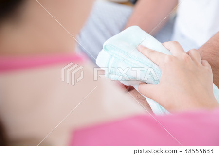 Carer and elderly person Elderly care Assistance scene Clean up Wipe body Body parts Parts cut Faceless 38555633