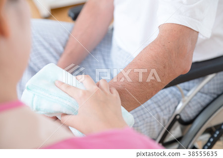 Carer and elderly person Elderly care Assistance scene Clean up Wipe body Body parts Parts cut Faceless 38555635