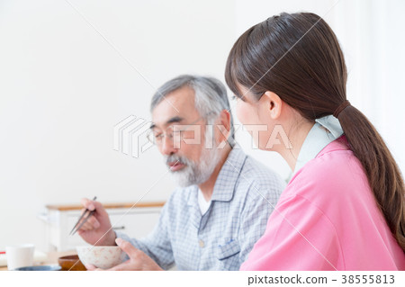 Young carer and grandpa enjoy meal conversation assistance nutrition management nursing home day care center Young carer and grandpa enjoy meal conversation assistance nutrition management nursing home day care center 38555813