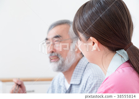 Young carer and grandpa enjoy meal conversation assistance nutrition management nursing home day care center Young carer and grandpa enjoy meal conversation assistance nutrition management nursing home day care center 38555814