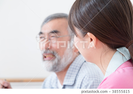 Young carer and grandpa enjoy meal conversation assistance nutrition management nursing home day care center Young carer and grandpa enjoy meal conversation assistance nutrition management nursing home day care center 38555815