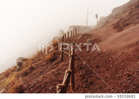 people climb the mountain on the trail 38558691