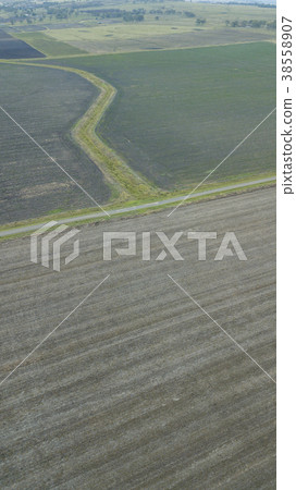 Country agricultural and farming field. Country agricultural and farming field. 38558907