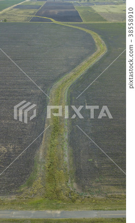 Country agricultural and farming field. Country agricultural and farming field. 38558910