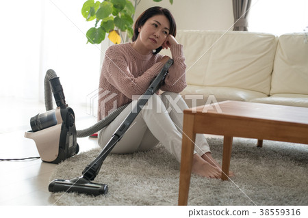 Middle housewife tired of cleaning Japanese woman Middle housewife tired of cleaning Japanese woman 38559316