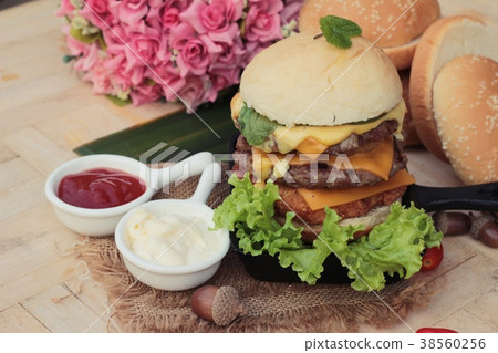 Double hamburger with double cheese is tasty. Double hamburger with double cheese is tasty. 38560256