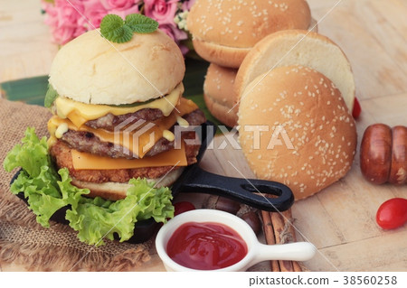 Double hamburger with double cheese is tasty. Double hamburger with double cheese is tasty. 38560258