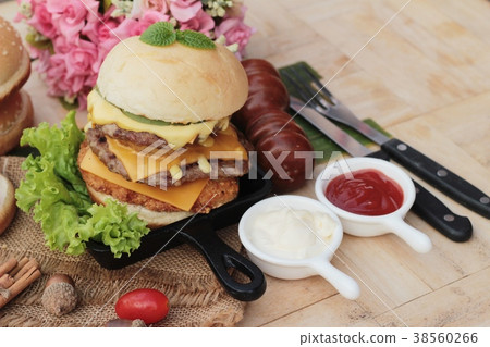 Double hamburger with double cheese is tasty. 38560266