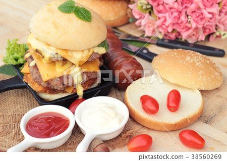 Double hamburger with double cheese is tasty. 38560269