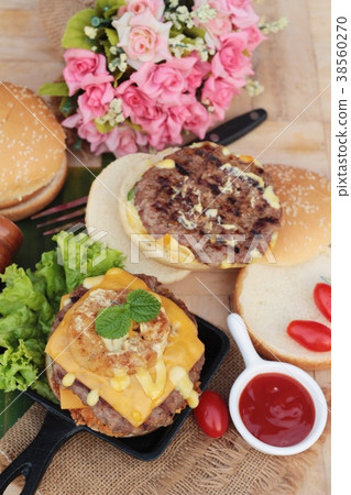 Double hamburger with double cheese is tasty. 38560270