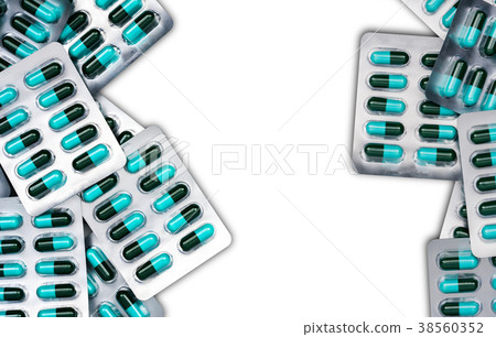 Top view of blue, green antibiotics capsule pills 38560352