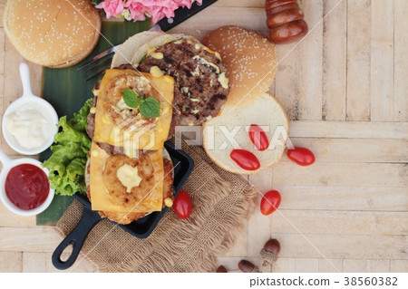 Double hamburger with double cheese is tasty. 38560382