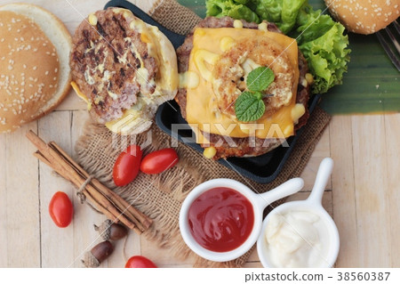 Double hamburger with double cheese is tasty. 38560387