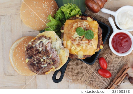 Double hamburger with double cheese is tasty. 38560388
