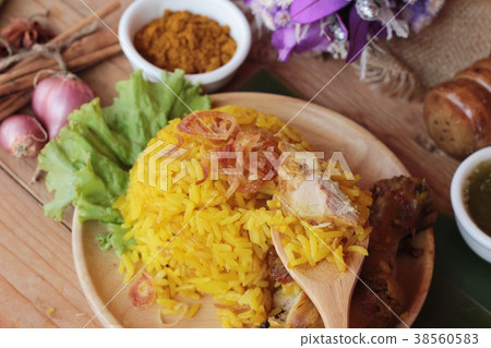 chicken biryani with rice delicious and sauce. chicken biryani with rice delicious and sauce. 38560583