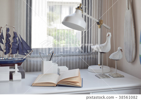 table with lamp,pencils and books in working room table with lamp,pencils and books in working room 38561082