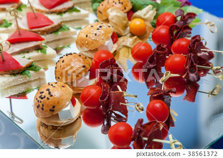 Canape for a buffet table, appetizer. 38561372