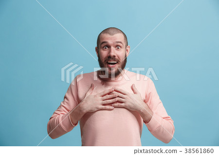 The young attractive man looking suprised isolated The young attractive man looking suprised isolated 38561860
