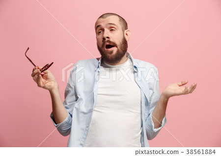 Beautiful bored man bored isolated on pink Beautiful bored man bored isolated on pink 38561884