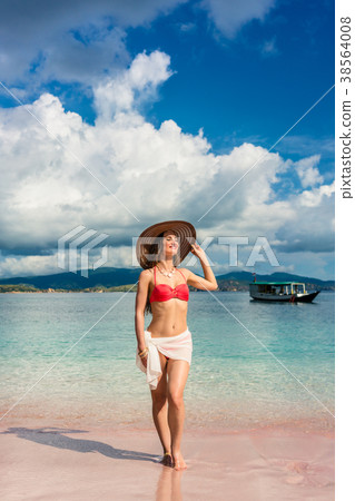 Fashionable young woman smiling while posing Fashionable young woman smiling while posing 38564008