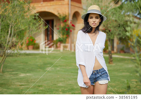 Girl in tuscan field near garden in Toscana, Italy 38565195